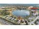 Aerial view of home, highlighting its location near lake and clubhouse at 524 Lake Suzanne Dr, Lake Wales, FL 33859
