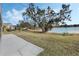 Large backyard with lake view and patio at 524 Lake Suzanne Dr, Lake Wales, FL 33859