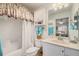 Well-lit bathroom with shower/tub combo and vanity at 524 Lake Suzanne Dr, Lake Wales, FL 33859