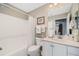 Clean bathroom with a shower/tub combo, toilet and vanity at 524 Lake Suzanne Dr, Lake Wales, FL 33859