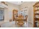 Charming dining area with round table and French doors leading to the backyard at 524 Lake Suzanne Dr, Lake Wales, FL 33859