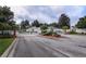 Gated entrance to a residential community with landscaping at 524 Lake Suzanne Dr, Lake Wales, FL 33859