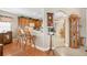 Kitchen with wooden cabinets and breakfast bar with two chairs at 524 Lake Suzanne Dr, Lake Wales, FL 33859