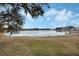 Peaceful lake view with lush green grass at 524 Lake Suzanne Dr, Lake Wales, FL 33859