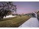 Peaceful lakefront view with homes and lush greenery at 524 Lake Suzanne Dr, Lake Wales, FL 33859