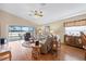 Spacious living room with lake view, hardwood floors, and comfy furniture at 524 Lake Suzanne Dr, Lake Wales, FL 33859