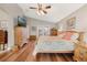 Spacious main bedroom with king-size bed, wood floors, and patio access at 524 Lake Suzanne Dr, Lake Wales, FL 33859