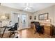 Home office with a desk, chair, and access to a private patio at 524 Lake Suzanne Dr, Lake Wales, FL 33859