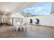 Screened patio with table, chairs, and storage shed at 524 Lake Suzanne Dr, Lake Wales, FL 33859