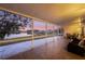 Spacious screened porch overlooking a tranquil lake at 524 Lake Suzanne Dr, Lake Wales, FL 33859