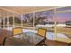 Relaxing screened porch with lake view and outdoor seating at 524 Lake Suzanne Dr, Lake Wales, FL 33859