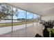 Relaxing screened porch overlooking lake and golf course at 524 Lake Suzanne Dr, Lake Wales, FL 33859