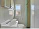 Clean bathroom with white vanity and shower at 557 Thornburg Rd, Babson Park, FL 33827