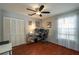 Home office with wood flooring and built-in shelving at 658 Jaguar Ct, Kissimmee, FL 34759