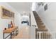 Bright entryway with staircase and view into living room at 716 Brooklet Dr, Davenport, FL 33837