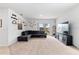 Bright living room featuring a comfortable sectional sofa and backyard view at 716 Brooklet Dr, Davenport, FL 33837