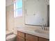 Bathroom with a sink, toilet, and combined tub and shower at 746 Platypus Ct, Kissimmee, FL 34759