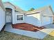 Beautiful single-story home with attached two-car garage, manicured landscaping, and freshly laid mulch at 746 Platypus Ct, Kissimmee, FL 34759