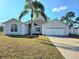 Charming single Gathering home with a well-maintained lawn and two car garage at 746 Platypus Ct, Kissimmee, FL 34759