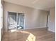 Open-concept living space with sliding glass doors and wood-look flooring, providing an airy feel at 746 Platypus Ct, Kissimmee, FL 34759