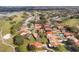 Aerial view of a neighborhood with lush green trees and landscaping, showcasing community living at 768 Canberra Rd, Winter Haven, FL 33884