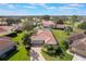 Aerial view of a single Gathering home with a tile roof and lush landscaping at 768 Canberra Rd, Winter Haven, FL 33884