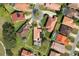 Aerial view of a home featuring a screened pool and mature trees at 768 Canberra Rd, Winter Haven, FL 33884