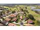 Stunning aerial view of a residential neighborhood with a golf course, lakes, and well-maintained landscaping at 768 Canberra Rd, Winter Haven, FL 33884