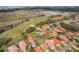 Aerial view of a neighborhood near the highway, with lush green trees and landscaping, showcasing community living at 768 Canberra Rd, Winter Haven, FL 33884