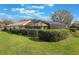 This home has a well-manicured lawn, and a large screened-in patio with a pool and plenty of space for entertaining at 768 Canberra Rd, Winter Haven, FL 33884