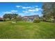 Spacious backyard with a screened-in pool area, perfect for outdoor activities and relaxation at 768 Canberra Rd, Winter Haven, FL 33884