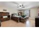 Cozy bedroom with hardwood floors, a ceiling fan, and a window, creating a relaxing atmosphere at 768 Canberra Rd, Winter Haven, FL 33884