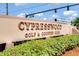 Cypresswood Golf & Country Club sign with landscaping and blue skies at 768 Canberra Rd, Winter Haven, FL 33884