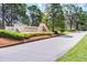 Cypresswood Golf & Country Club entrance with lush landscaping and well-maintained signage at 768 Canberra Rd, Winter Haven, FL 33884