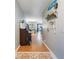 Inviting hallway featuring beautiful tile flooring, stylish decorations, and ample space, leading to the living areas at 768 Canberra Rd, Winter Haven, FL 33884