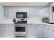 Well-equipped kitchen with stainless steel appliances and ample cabinet space at 768 Canberra Rd, Winter Haven, FL 33884