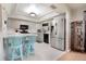 Bright kitchen boasts modern appliances, a breakfast bar with seating, and ample counter space for cooking at 768 Canberra Rd, Winter Haven, FL 33884