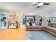 Open-concept living area with comfortable seating and view of the dining area and kitchen at 768 Canberra Rd, Winter Haven, FL 33884