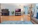 A stylish living room with hardwood floors and a cozy seating area, perfect for entertaining and relaxation at 768 Canberra Rd, Winter Haven, FL 33884