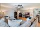 Comfortable living room with hardwood floors, ceiling fan and lots of seating at 768 Canberra Rd, Winter Haven, FL 33884