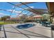 Enclosed pool area with comfortable lounge furniture, perfect for relaxation and outdoor entertaining at 768 Canberra Rd, Winter Haven, FL 33884