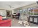 Versatile sunroom with an office setup and casual seating, filled with natural light at 768 Canberra Rd, Winter Haven, FL 33884