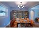 Rustic dining area with wooden table and leather chairs at 811 Bonnie Dr, Lakeland, FL 33803