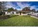 Updated craftsman home with a charming front yard and freshly paved driveway at 811 Bonnie Dr, Lakeland, FL 33803