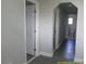 Clean hallway with archways, tile flooring, and white doors at 8150 State Road 60 E, Bartow, FL 33830