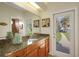 Bathroom with vanity, granite countertop and backyard access at 8323 W Lake Marion Rd, Haines City, FL 33844