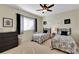 Bedroom with twin beds, window seating and neutral decor at 8323 W Lake Marion Rd, Haines City, FL 33844
