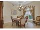 Bright dining room with large window and chandelier at 8323 W Lake Marion Rd, Haines City, FL 33844