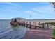 Private dock with covered boat storage on the lake at 8323 W Lake Marion Rd, Haines City, FL 33844