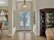 Elegant entryway with tiled floors and double doors at 8323 W Lake Marion Rd, Haines City, FL 33844